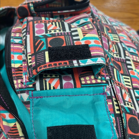 Kavu sling bag backpack in geometric print of Spring Montage.  Good condition.